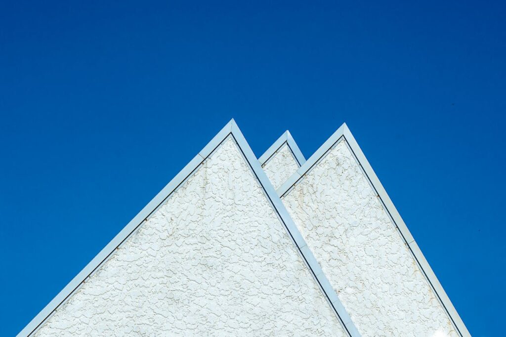 pexels-photo-20399114 A white triangular building with blue sky in the background